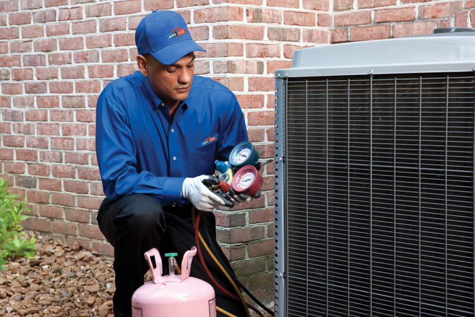 man fixing hvac system